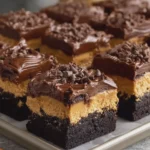 Peanut Butter Cup Brownie Cheesecake Bars