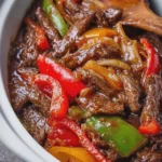 Saucy Homestyle Crockpot Pepper Steak Loaded with Juicy Beef Sweet Peppers and Onions