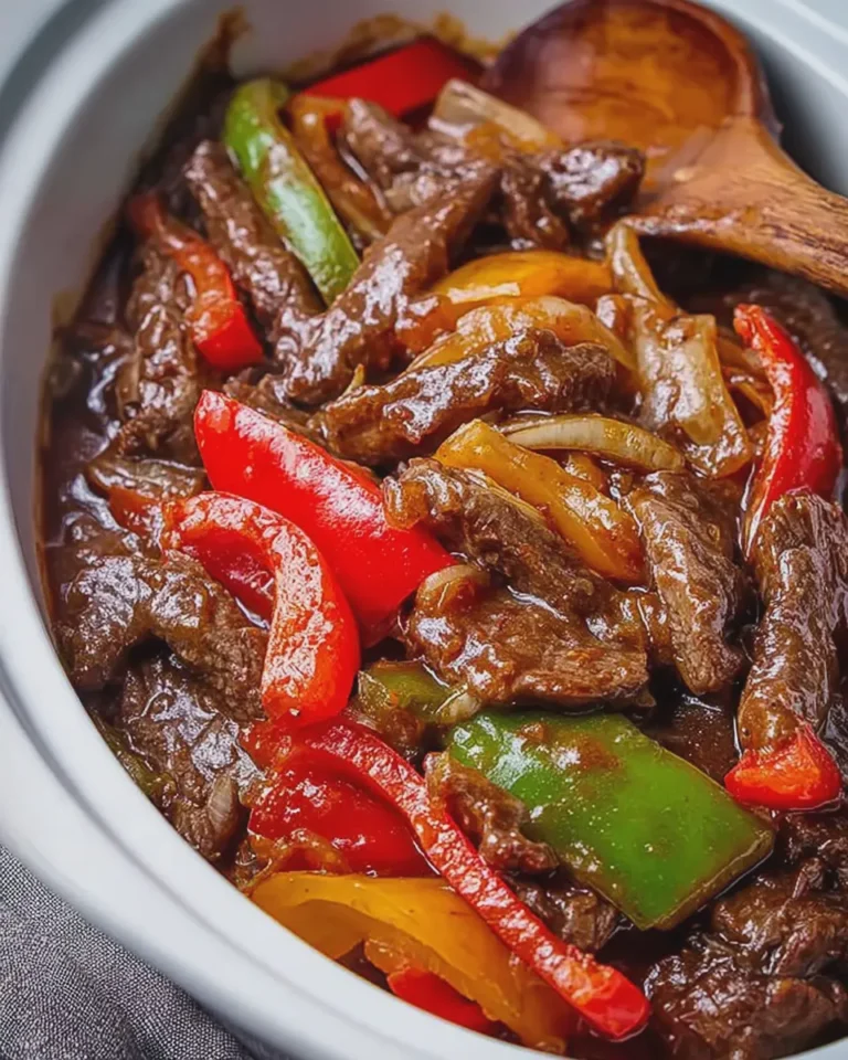 Saucy Homestyle Crockpot Pepper Steak Loaded with Juicy Beef Sweet Peppers and Onions
